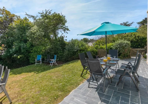 The patio, barbecue, alfresco dining area & enclosed garden at Bars House, Trebetherick