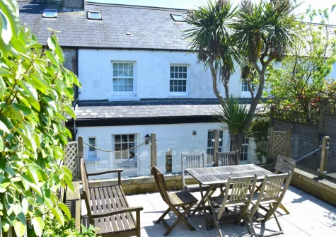 The rear patio, alfresco dining area at Bay Cottage, Gorran Haven
