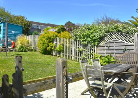 The rear patio, alfresco dining area & garden at Bay Cottage, Gorran Haven