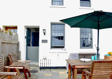 The front patio, alfresco dining & outdoor sitting area at Bay Cottage, Gorran Haven