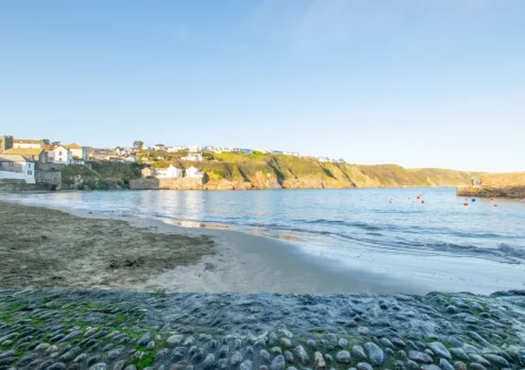 Gorran Haven Beach is a tranquil, sheltered sandy cove with an historic harbour wall