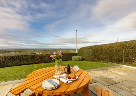 The front patio & alfresco dining area at Bay Ridge, Appledore