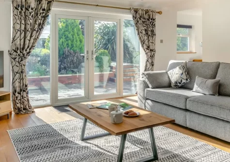 Bay Side, Northam is a stylish four-bedroom riverside retreat featuring a private hot tub, games room, and enclosed garden. Perfectly positioned between historic Bideford and golden Westward Ho!, it offers modern luxury with coastal adventures.