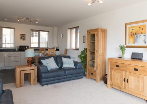 The open plan living & dining area and kitchen @ Bay View Apartment, St Austell