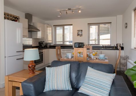 The open plan living & dining area and kitchen @ Bay View Apartment, St Austell