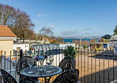 The front patio & outdoor sitting area at Bay View, Brixham Holiday Park, Brixham