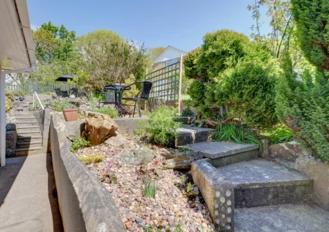 The tiered garden & outdoor sitting area at Bay View Bungalow, Combe Martin