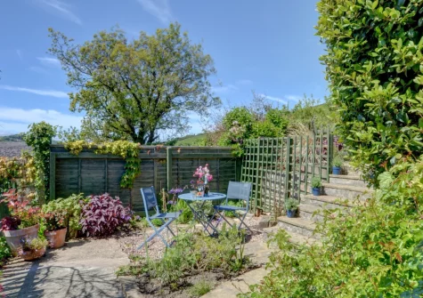 The tiered garden & outdoor sitting area at Bay View Bungalow, Combe Martin