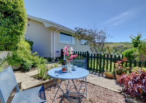 The tiered garden & outdoor sitting area at Bay View Bungalow, Combe Martin