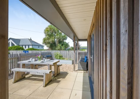 The enclosed patio, barbecue & alfresco dining area at Beach Combers, Widemouth Bay