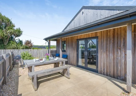The enclosed patio, barbecue & alfresco dining area at Beach Combers, Widemouth Bay