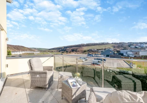 The sea-facing balcony & outdoor sitting area at Beach Haven, Newquay