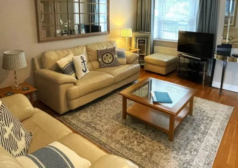 Beach Mews, Torquay is a handsome two-bedroom townhouse just 320 metres from Meadfoot Beach, featuring an enclosed courtyard for al fresco dining, elegant interiors with coastal touches, and easy access to the English Riviera's finest attractions.