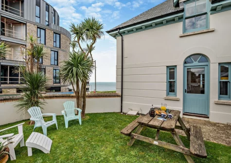 The enclosed lawned garden & alfresco dining area at Beachside, Newquay