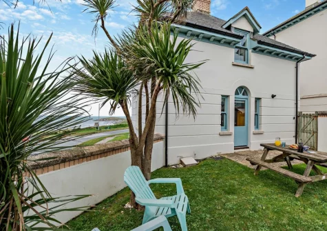 The enclosed lawned garden & alfresco dining area at Beachside, Newquay
