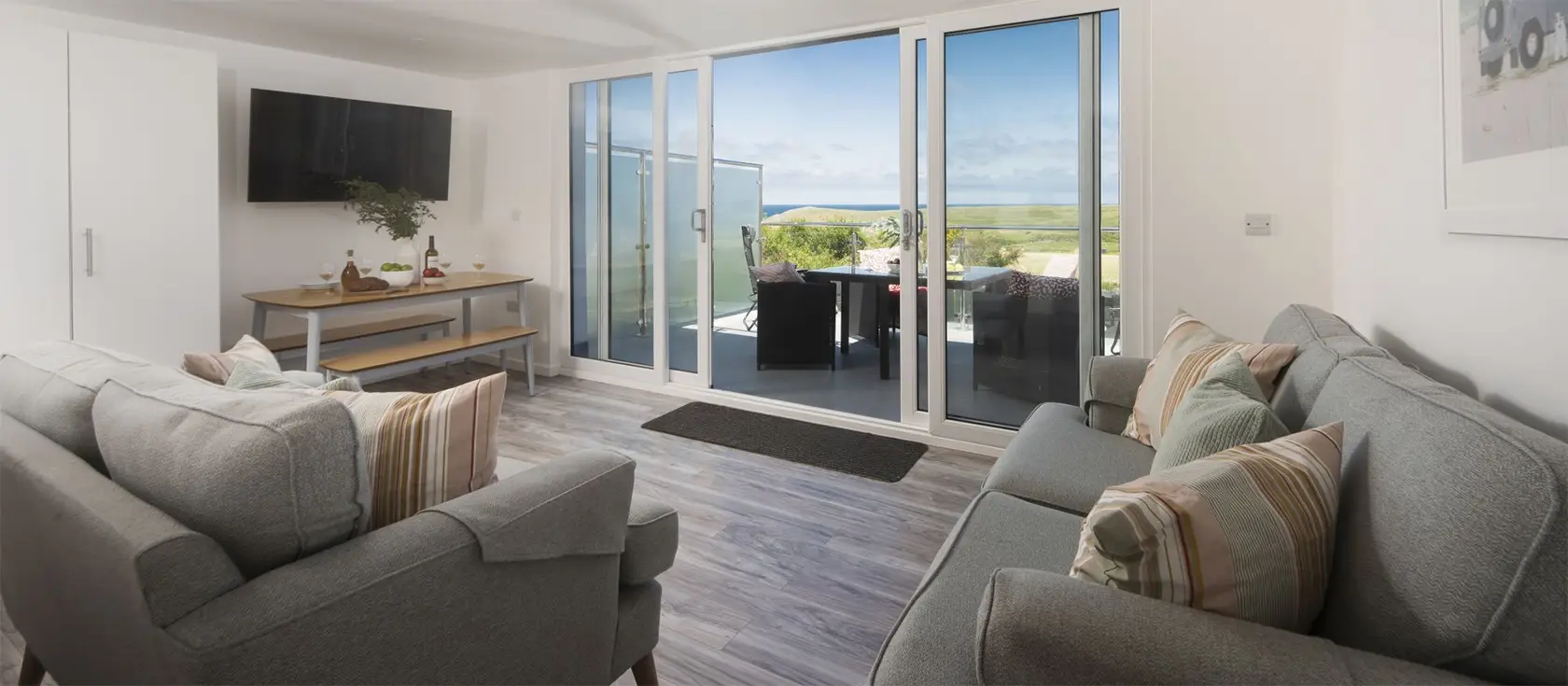 Beachview Apartment 1, Crantock is one of nine luxury apartments with glass balcony & panoramic sea views. Two bedrooms & two bathrooms sleep four. Open floorplan, modern kitchen with granite counters & dishwasher. Parking. Walk to shop, pub & beach.