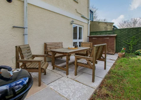 The patio, barbecue & alfresco dining area at Beech Cottage, Rousdon