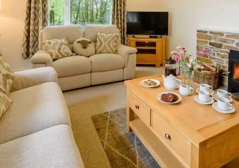 Beechcroft, Clawton is a stylish three-bedroom bungalow offering contemporary comfort with the extraordinary bonus of a shared indoor pool, sauna and hot tub. Enjoy peaceful countryside views, an enclosed garden, & easy access to local attractions.