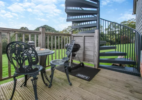 The decked balcony, barbecue & alfresco dining area at Bella's Place, Ponsanooth