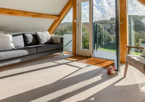 Bella's Place, Ponsanooth is a charming timber-clad apartment perfect for couples, boasting a private balcony with glorious countryside views, cosy open-plan interiors, and easy access to Falmouth and Cornwall's finest coastal attractions.