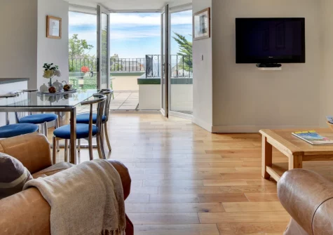 Belle View, Ilfracombe is a charming first-floor apartment just off the high street, featuring an open terrace with harbour views, modern interiors throughout, and easy access to the town's historic harbour and dramatic coastal paths.