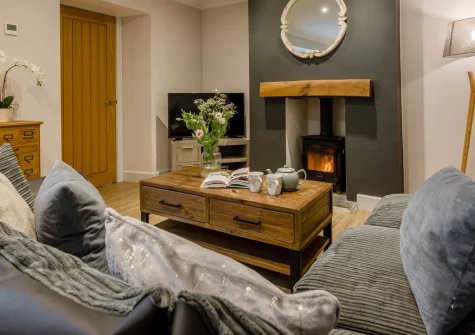 Berea House, Polperro is a stylish three-bedroom cottage in the heart of this enchanting fishing village, featuring contemporary interiors, a private terrace, wood burner warmth, and the rare luxury of dedicated parking in coastal Cornwall.