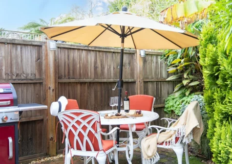 The courtyard garden, barbecue & alfresco dining area at Beryas Cottage, Buryas Bridge