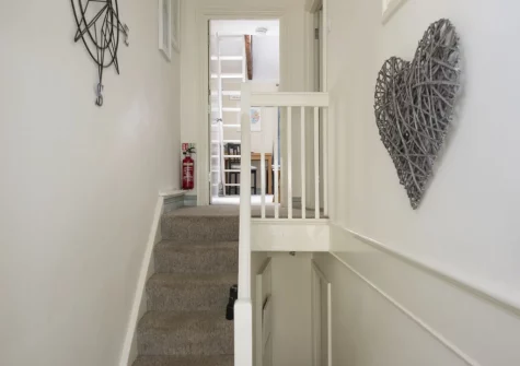The entrance with stairs up to the bedroom & living room at Bessie Ellen's Cottage, Fowey