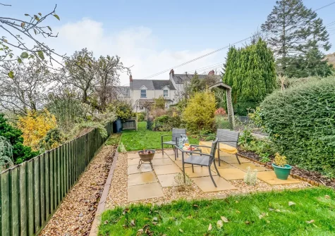 The patio, outdoor sitting area & garden at Betty's Cottage, Bishop's Tawton