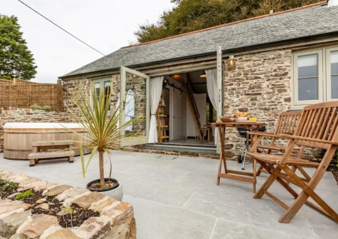 The patio, hot tub & oudoor sitting area at Birdsong Barn, Combe Martin