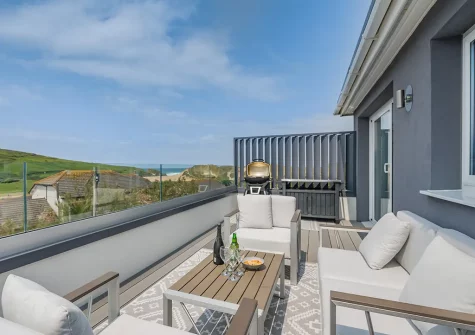 The decked balcony, barbecue & outdoor sitting area at decked balcony & outdoor sitting area