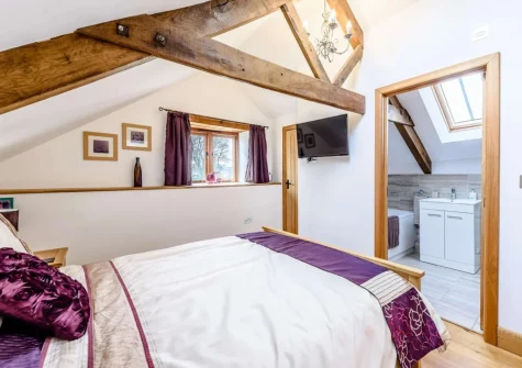 Bedroom #1 & en-suite bathroom at Bluebell Barn, Alfardisworthy