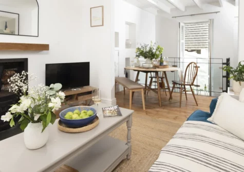 Bluebell Cottage, St Ives is a charming three-bedroom townhouse set over four levels in the heart of this beloved coastal town, featuring a cosy wood burner, sunny courtyard garden, and effortless access to golden beaches and galleries.