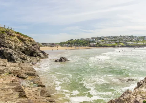 Polzeath Beach is known for its consistent surf & rock pools, which make it a favourite with both surfers & families