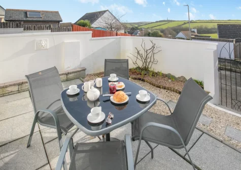 The enclosed courtyard garden & alfresco dining area at Blueskies, Padstow