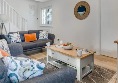 Blueskies, Padstow is a beautifully updated holiday home just a mile from Padstow's harbour, featuring a sunny enclosed patio with estuary glimpses, stylish contemporary interiors, and access to North Cornwall's legendary beaches & coastal trails.