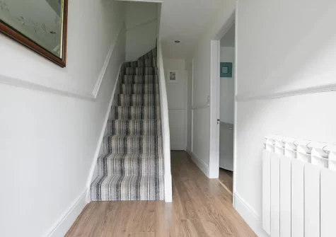 The hallway & stairs up to the first floor at Blythswood, Marazion