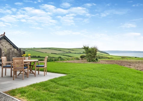 The patio, barbecue, alfresco dining area & enclosed garden at Boatlake Barn, Greencliff Farm, Abbotsham