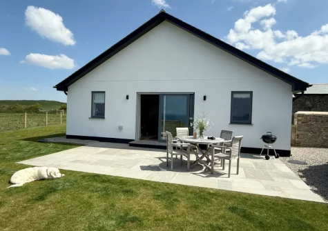 The patio, barbecue, alfresco dining area & enclosed garden at Boatlake Barn, Greencliff Farm, Abbotsham