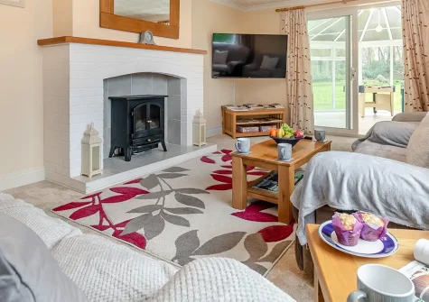 Bos-Coed, Perran Downs is a charming three-bedroom countryside retreat offering easy coastal access. Enjoy an extensive enclosed garden, entertaining games room, and Cornwall's stunning beaches nearby, perfect for unforgettable family holidays.