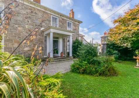 Boslandew House is a luxurious seven-bedroom detached cottage, built in 1868, in the peaceful village of Mousehole