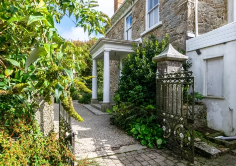 Boslandew House is a luxurious seven-bedroom detached cottage, built in 1868, in the peaceful village of Mousehole