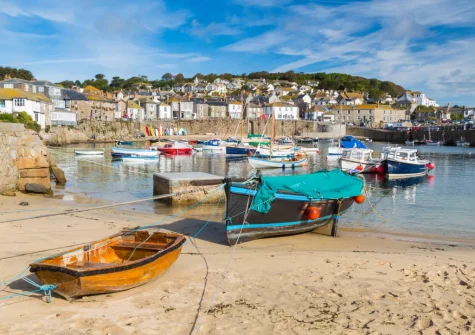 Visiting Mousehole Harbour offers a quintessential Cornish experience, characterised by its sheltered, sandy shores & historic charm