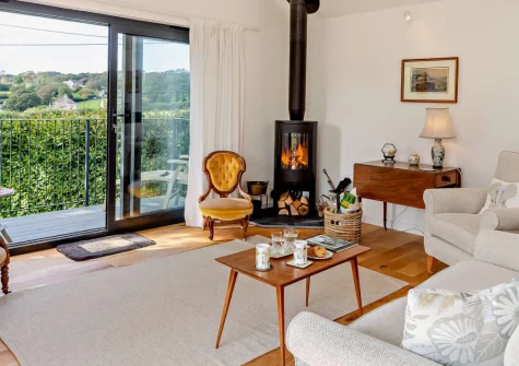 Bowhousehay, Albaston is a beautifully appointed modern house in the peaceful Tamar Valley, featuring reversed living with a stunning first-floor balcony, three ground-floor bedrooms, contemporary interiors, and a generous garden.