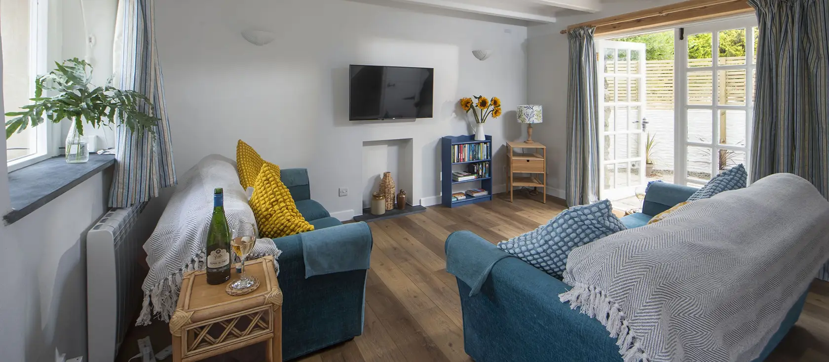 Bowjy Cottage, St Agnes is a charming two-bedroom barn conversion with coastal-inspired décor and private courtyard. Enjoy modern amenities, outdoor shower, and easy access to Cornwall's stunning north coast beaches and attractions.