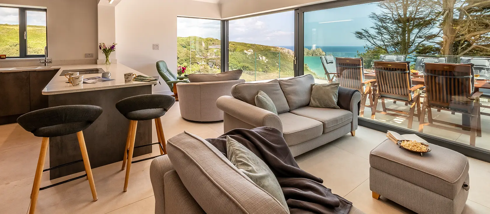 Bracken Bank, Porthcurno, is a luxurious four-bedroom home with stunning views over the beach and ocean. Experience modern elegance, spacious terraces, and proximity to the iconic Minack Theatre—perfect for an unforgettable Cornish coastal escape.