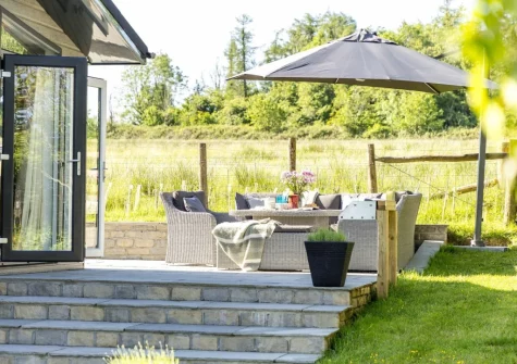The patio & alfresco dining area at Bramble Lodge, 12 Roadford Lake Lodges, Broadwoodwidger