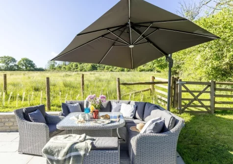 The patio & alfresco dining area at Bramble Lodge, 12 Roadford Lake Lodges, Broadwoodwidger