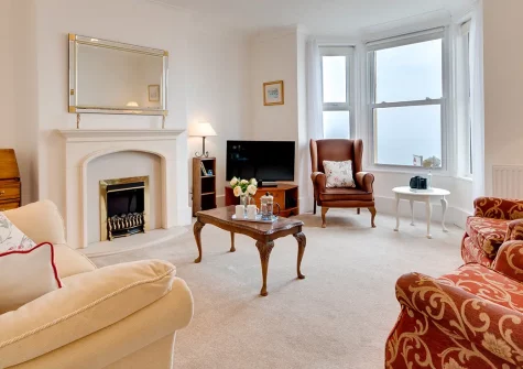 Brixham View, Seaton, is a classic two-bedroom first-floor apartment with spectacular sea views, antique furnishings, and two lounges. Ideally placed for exploring Devon's coast, beaches, and East Devon AONB. Perfect for memorable seaside escapes.