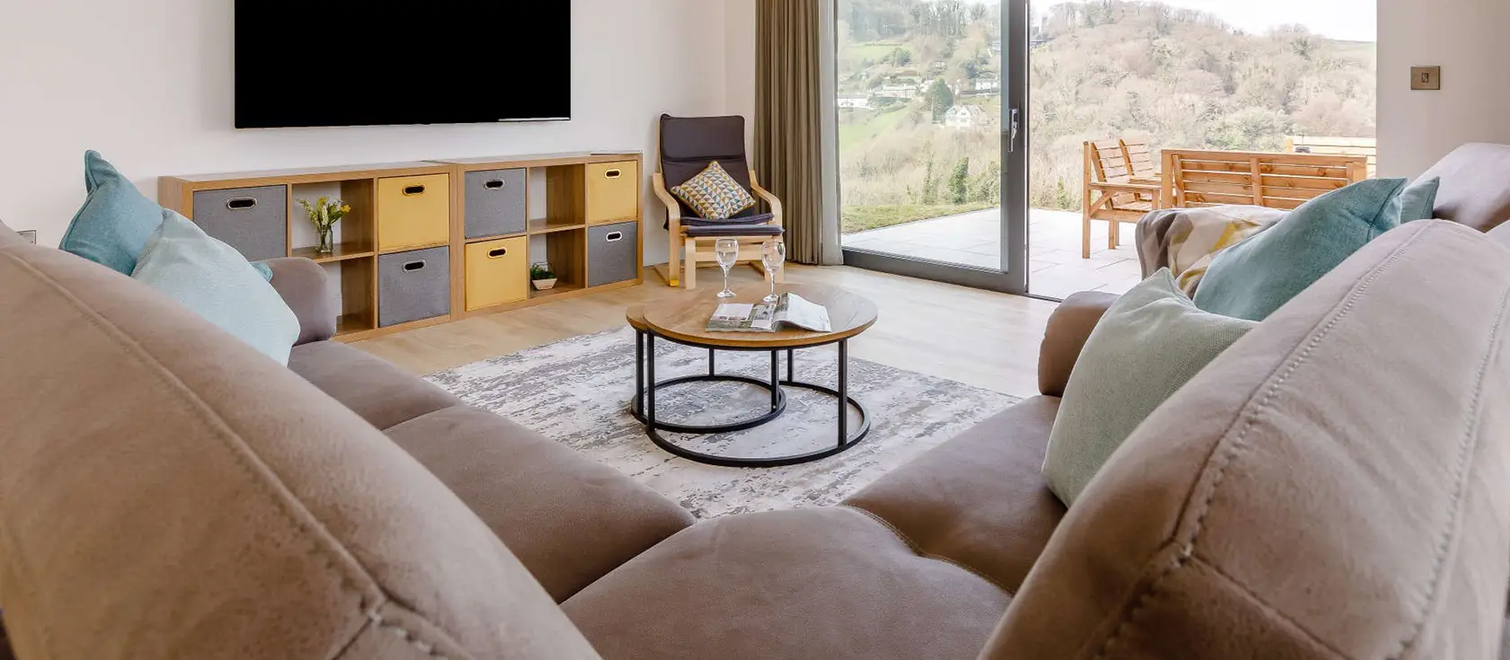 Broadsands Barn, Berrynarbor is a stunning detached barn conversion with panoramic sea views, featuring four bedrooms, a spacious open-plan living area & an enclosed garden with fire pit. Perfect for family gatherings or dog-friendly coastal breaks.